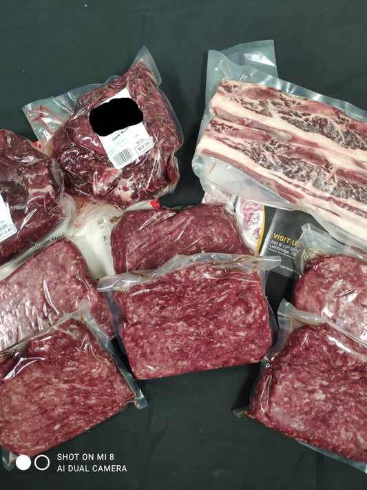Assorted packages of pasture raised stew meat, prime grind, ribs, and ground beef all dry aged and from Southern Alberta.